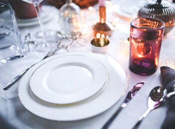 clean dishes placed on table plate silverwear water glass